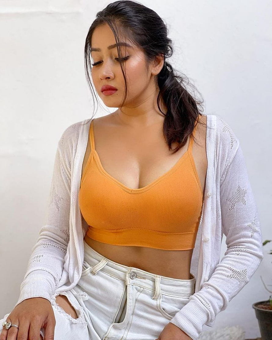 Sofia Ansari in Orange Crop Top and White Cardigan HD phone wallpaper