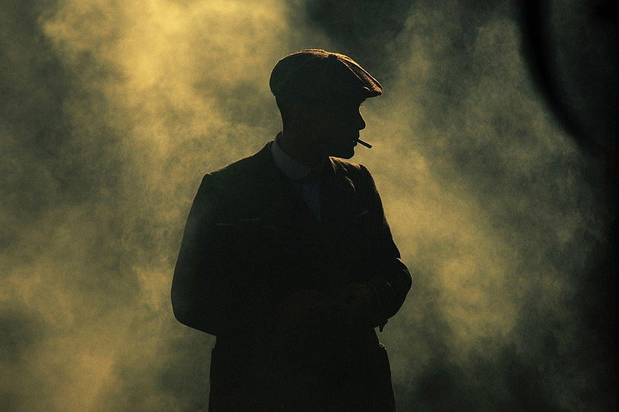 Peaky Blinders Silhouette in Dramatic Smoke and Golden Light HD wallpaper