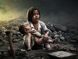 Young Girl Holding Baby Amidst Rubble and Smoke in a Desolate Landscape HD wallpaper