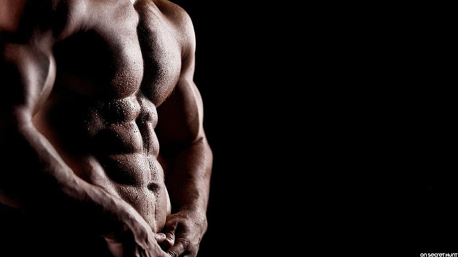 Dramatic Close-Up of Defined Male Abs and Pectorals in Dark Studio Lighting HD wallpaper