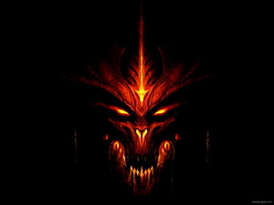 Fiery Red Demon Skull with Glowing Eyes and Horns on Black Background HD wallpaper