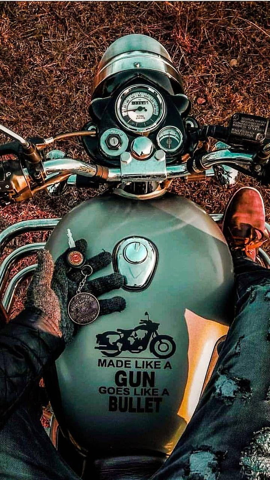 Royal Enfield Bullet Tank Close-Up With Rider's Gloved Hand and Keychain HD phone wallpaper