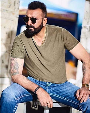 Sanjay Dutt in olive t-shirt and sunglasses with beard and tattoos HD phone wallpaper