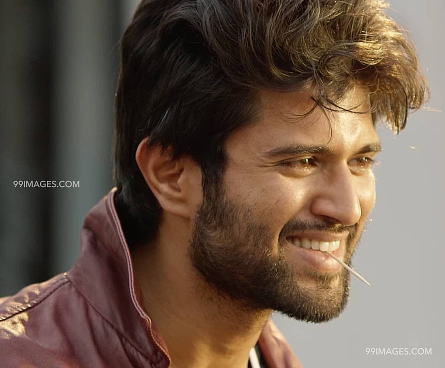 Vijay Deverakonda smiling close-up portrait with beard and maroon jacket HD wallpaper