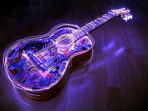 Glowing Acoustic Guitar with Sticker Collage and Neon Light Trails on Wooden Floor HD wallpaper