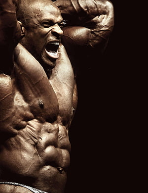 Ronnie Coleman Intense Bodybuilding Pose with Defined Muscles and Dramatic Lighting, ronnie coleman , #Ronnie Coleman HD phone wallpaper