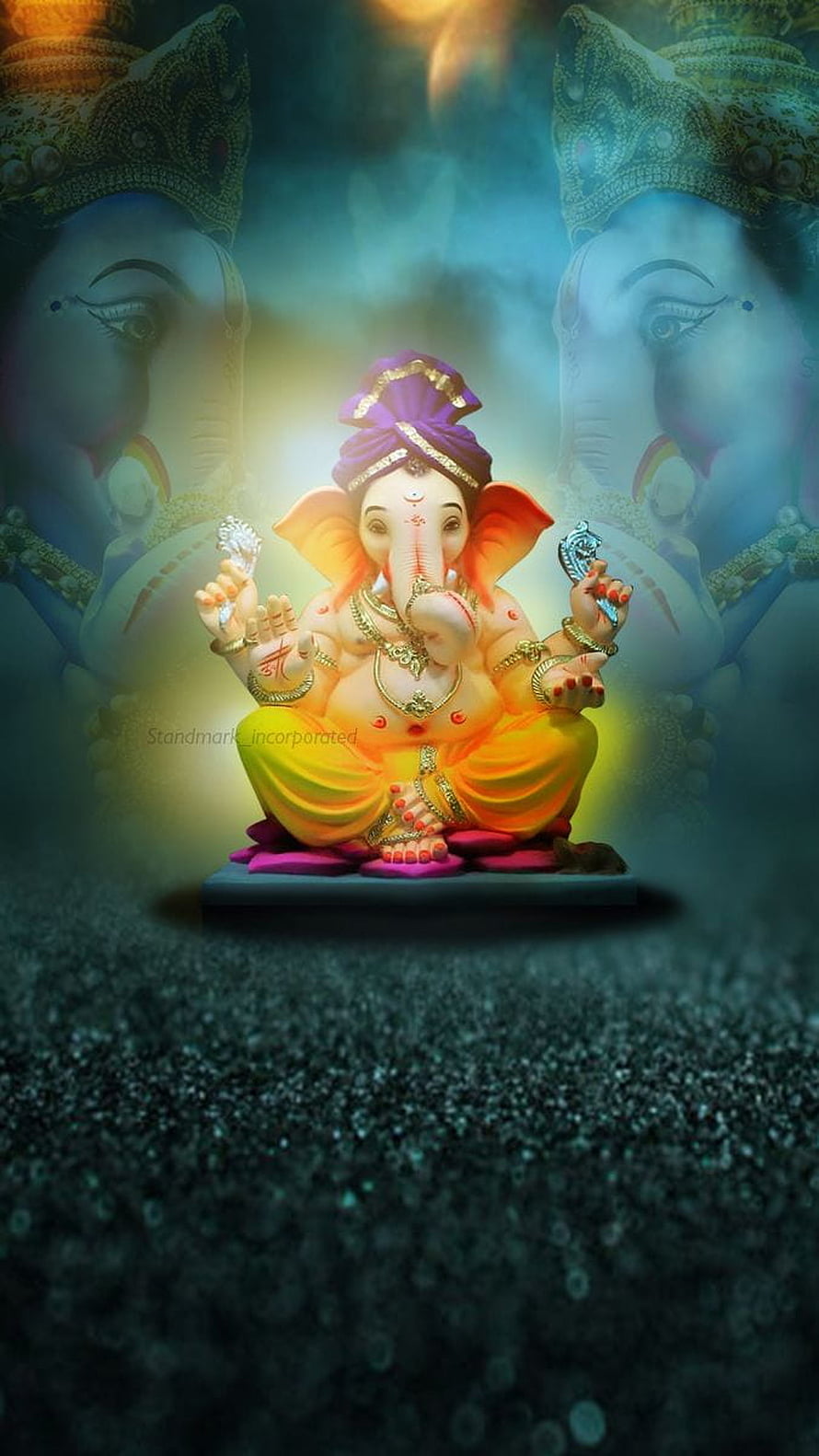 Ganesha Idol with Glowing Aura and Mystical Background HD phone wallpaper