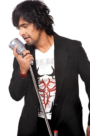 Sonu Nigam Singing Into Vintage Microphone in Black Blazer and Graphic Tee HD phone wallpaper