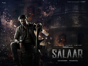 Prabhas as Salaar holding a rifle in a dark cinematic action movie poster with fire and debris HD wallpaper