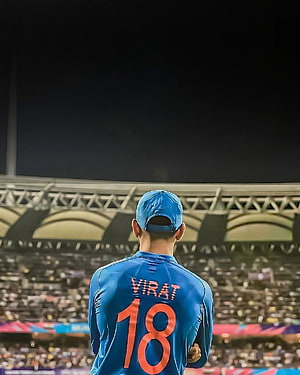 Virat Kohli in Blue India Jersey Number 18 Standing in Cricket Stadium HD phone wallpaper