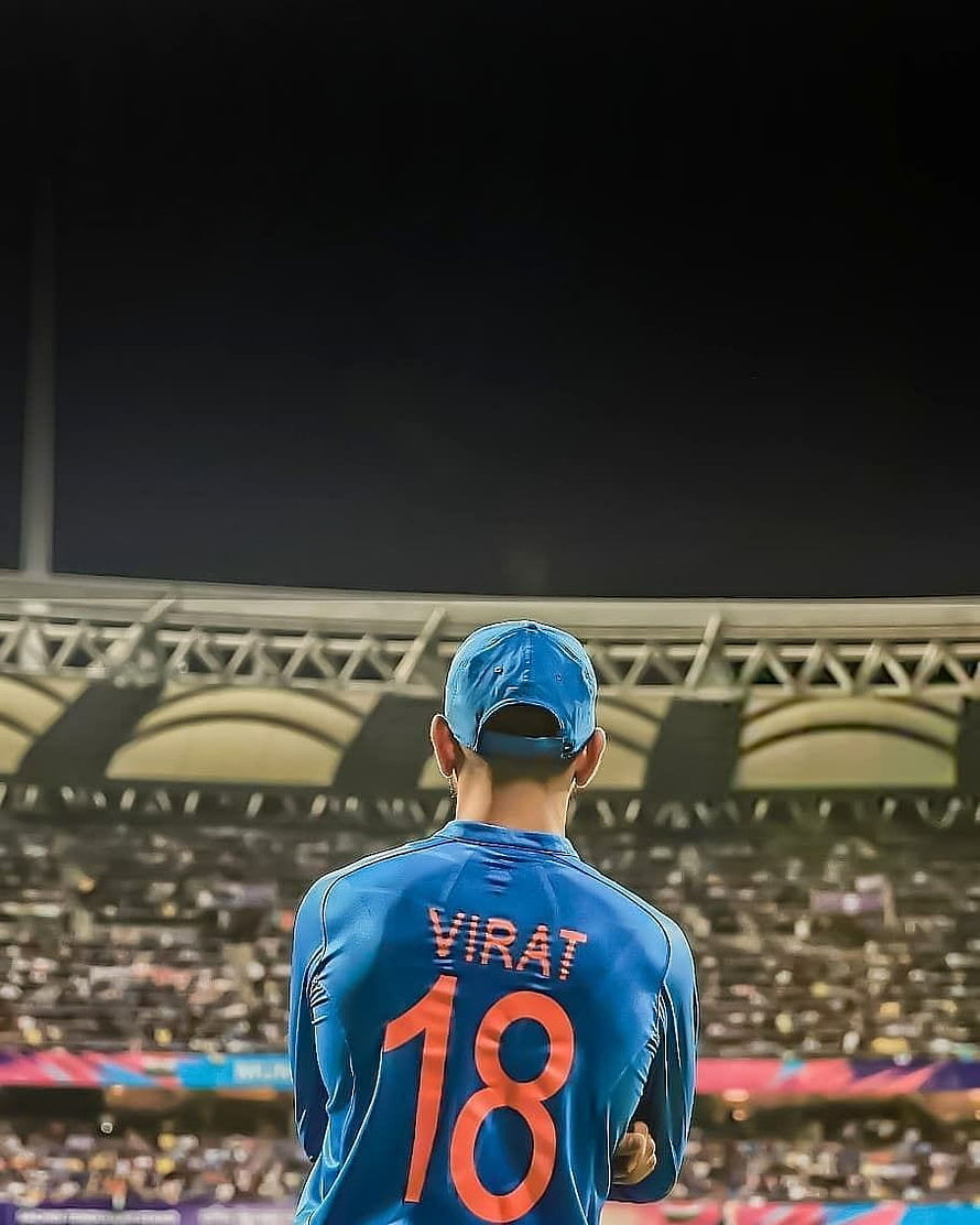Virat Kohli in Blue India Jersey Number 18 Standing in Cricket Stadium HD phone wallpaper