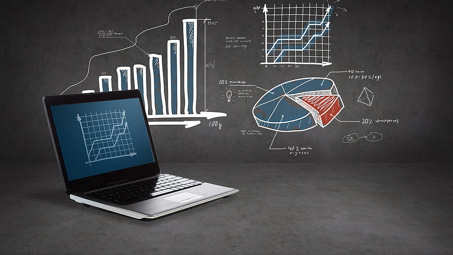 Laptop with data charts and graphs on a dark chalkboard background HD wallpaper