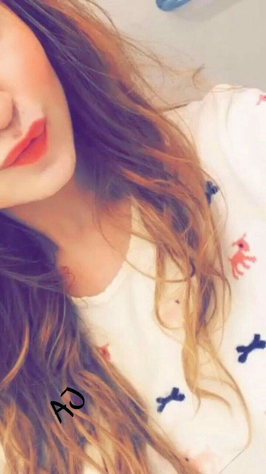 Close-up portrait of a woman with long wavy hair and red lipstick lying on a patterned pillow, Face Hide Girls posted by Samantha Simpson, hidden girl pic HD phone wallpaper