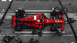 Aerial View of a Ferrari Formula 1 Pit Stop with Crew in Action HD wallpaper