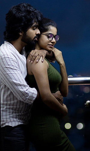 Romantic Night Scene of a Couple Embracing on a Balcony with City Lights, GV Prakash Bachelor Movie Stills, Gallery, bachelor tamil HD phone wallpaper