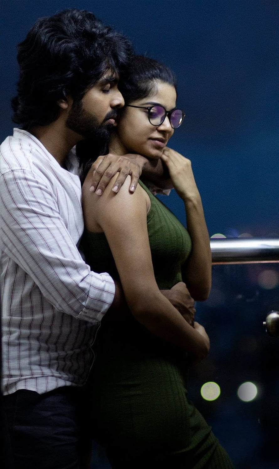 Romantic Night Scene of a Couple Embracing on a Balcony with City Lights, GV Prakash Bachelor Movie Stills, Gallery, bachelor tamil HD phone wallpaper