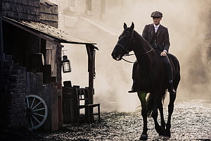 Thomas Shelby on Horseback in Misty Industrial Setting from Peaky Blinders HD wallpaper