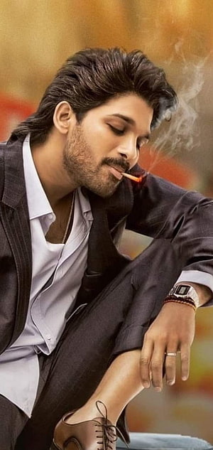 Allu Arjun in a stylish black suit smoking a cigarette with a serious expression HD phone wallpaper