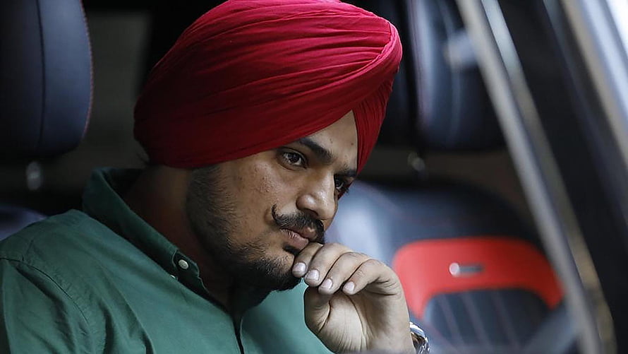 Portrait of a man wearing a red turban sitting inside a car with a thoughtful expression, Sidhu Moose Wala Best 47226, sidhu moose wala graphy HD wallpaper