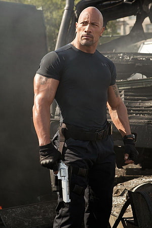 Dwayne Johnson in tactical gear holding a pistol in a destroyed urban setting HD phone wallpaper