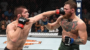 Khabib Nurmagomedov and Conor McGregor exchange strikes in UFC octagon HD wallpaper