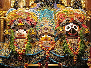 Ornate Jagannath Temple Deities in Puri with Elaborate Garlands and Traditional Attire HD wallpaper