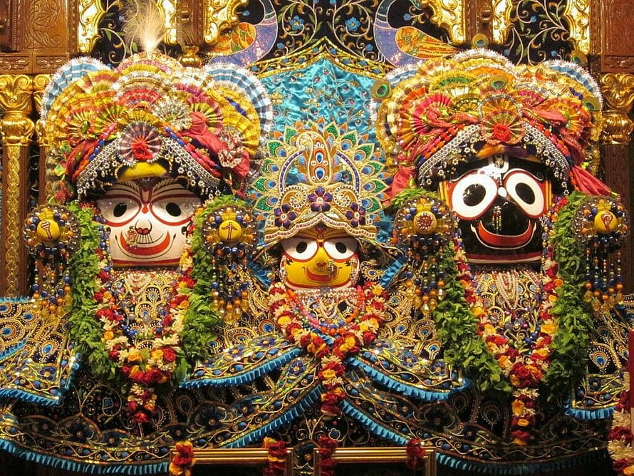 Ornate Jagannath Temple Deities in Puri with Elaborate Garlands and Traditional Attire HD wallpaper