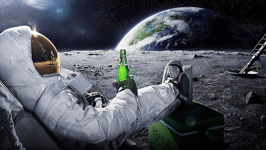 Astronaut Relaxing on the Moon with a Carlsberg Beer and Earth in the Background HD wallpaper