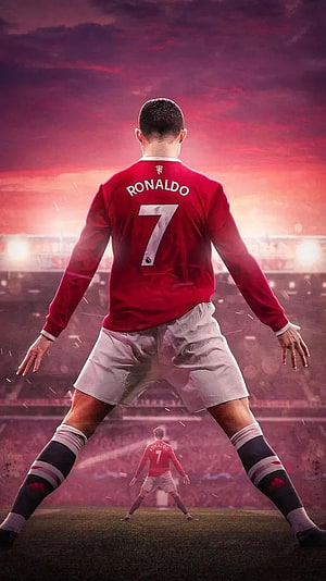 Cristiano Ronaldo in Manchester United Kit Standing on the Pitch at Sunset HD phone wallpaper