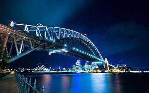 Sydney Harbour Bridge and Opera House Illuminated at Night Over the Water HD wallpaper