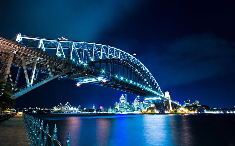 Sydney Harbour Bridge and Opera House Illuminated at Night Over the Water HD wallpaper