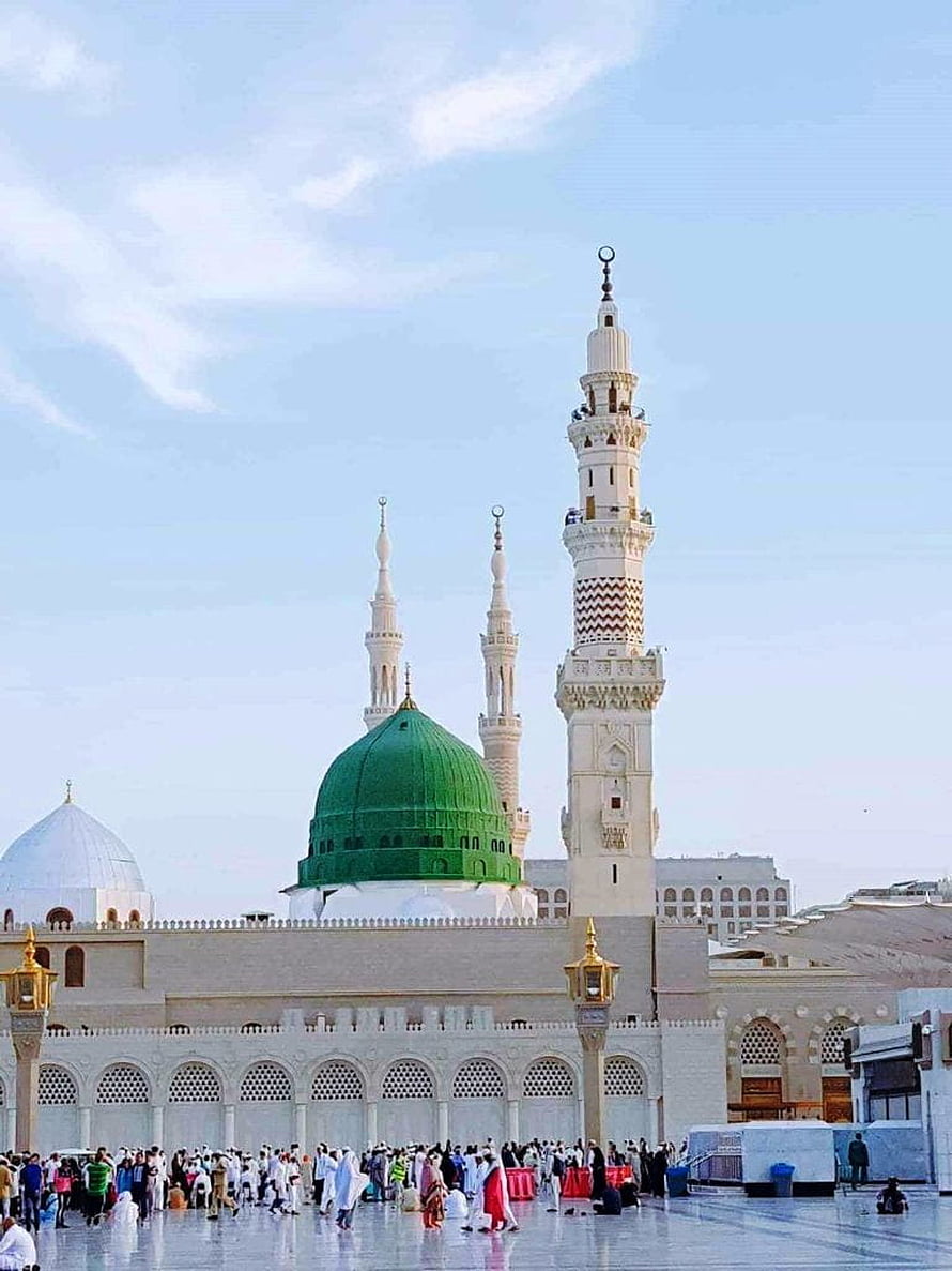 The Green Dome of the Prophet's Mosque in Medina with Minarets and Pilgrims HD phone wallpaper