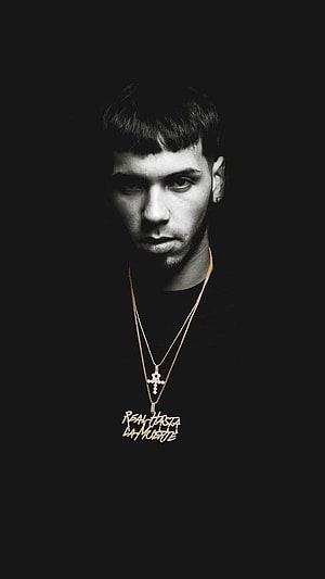 Anuel AA Black and White Portrait with Gold Cross Necklace and Pendant HD phone wallpaper