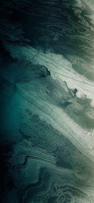Abstract Aerial View of Glacial Terrain in Deep Teal and White Tones HD phone wallpaper