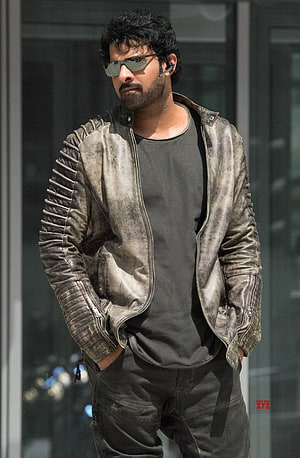 Pawan Kalyan in a distressed leather jacket and sunglasses HD phone wallpaper