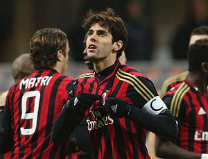 Kaka in AC Milan Striped Kit Pointing to Club Crest on Chest HD wallpaper