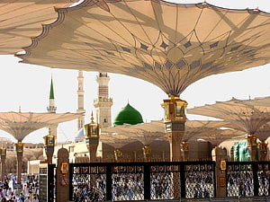 Grand Mosque of Medina with Green Dome and Minarets Under Ornate Canopy HD wallpaper