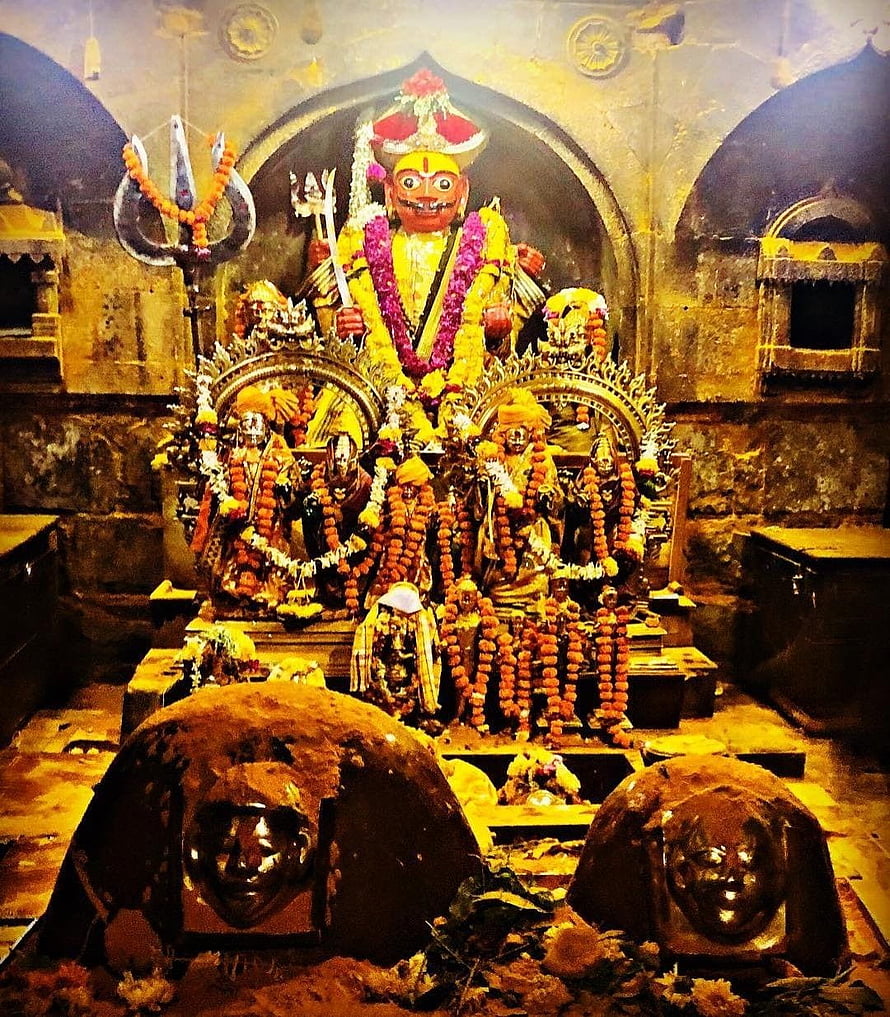 Khandoba Deity Shrine Adorned With Marigold Garlands And Traditional Ritual Offerings HD phone wallpaper