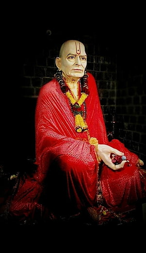 Statue of Hindu Saint Ramakrishna Paramahamsa in Red Robes HD phone wallpaper