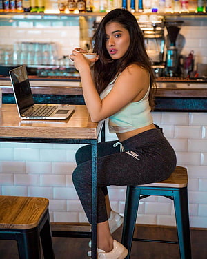 Young Woman in Casual Sportswear Sitting at a Cafe Table with Laptop, Ketika Sharma Age, Hot Pics, Wiki, Biography, Movies, Boyfriend » Celebzbiography, kethika sharma HD phone wallpaper