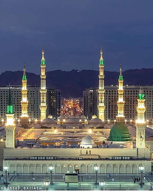 Al-Masjid an-Nabawi in Medina at Night with Illuminated Minarets and Green Dome HD phone wallpaper