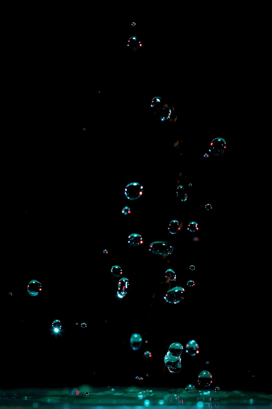 Iridescent Water Bubbles Rising Against a Deep Black Background HD phone wallpaper