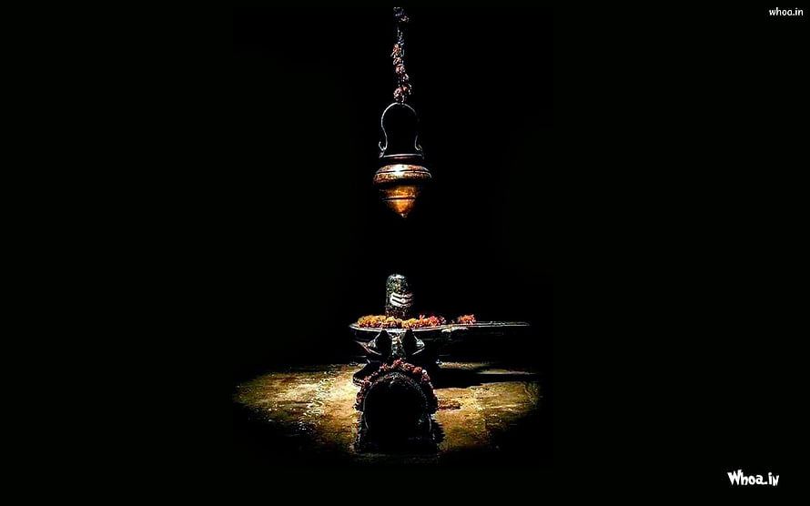 Dark Hindu Temple Ritual With Hanging Brass Lamp And Shiva Lingam HD wallpaper