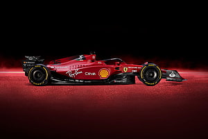 Ferrari Formula 1 Race Car on Red Track Surface with Sponsor Logos HD wallpaper