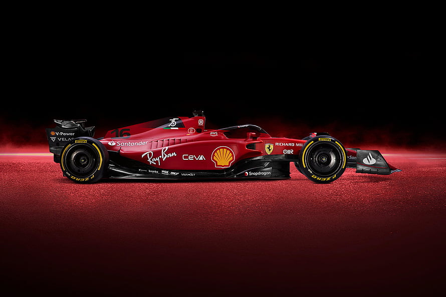 Ferrari Formula 1 Race Car on Red Track Surface with Sponsor Logos HD wallpaper