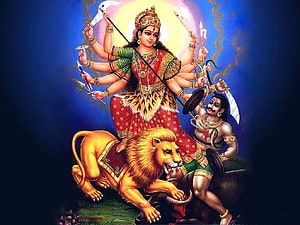 Maa Durga Riding Lion with Multiple Arms Holding Weapons in Traditional Indian Art HD wallpaper