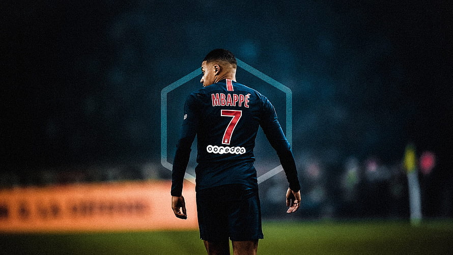 Kylian Mbappe in Paris Saint-Germain Away Kit Walking on the Pitch at Night HD wallpaper