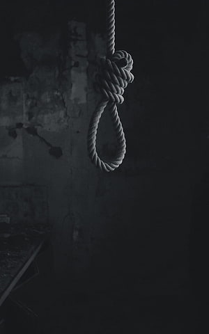 Dark Noose Hanging in Abandoned Room with Peeling Walls and Moody Atmosphere HD phone wallpaper