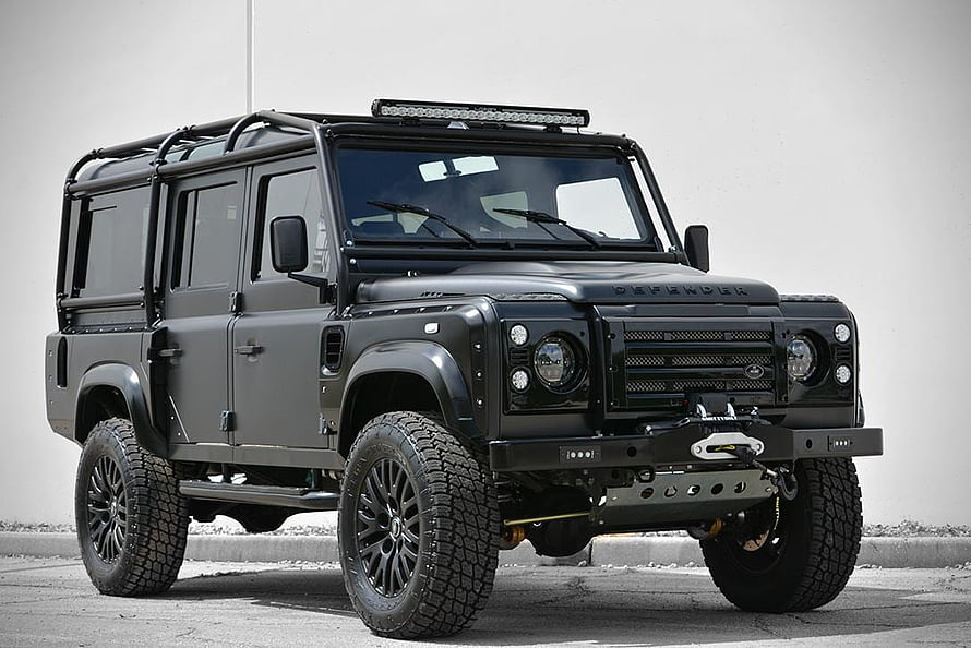 Black Land Rover Defender 110 Off-Road SUV with Roof Rack and LED Light Bar HD wallpaper