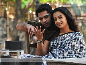 Vinnaithaandi Varuvaayaa romantic couple scene in a rustic outdoor setting HD wallpaper